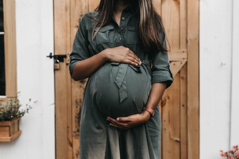 pregnant woman holding belly