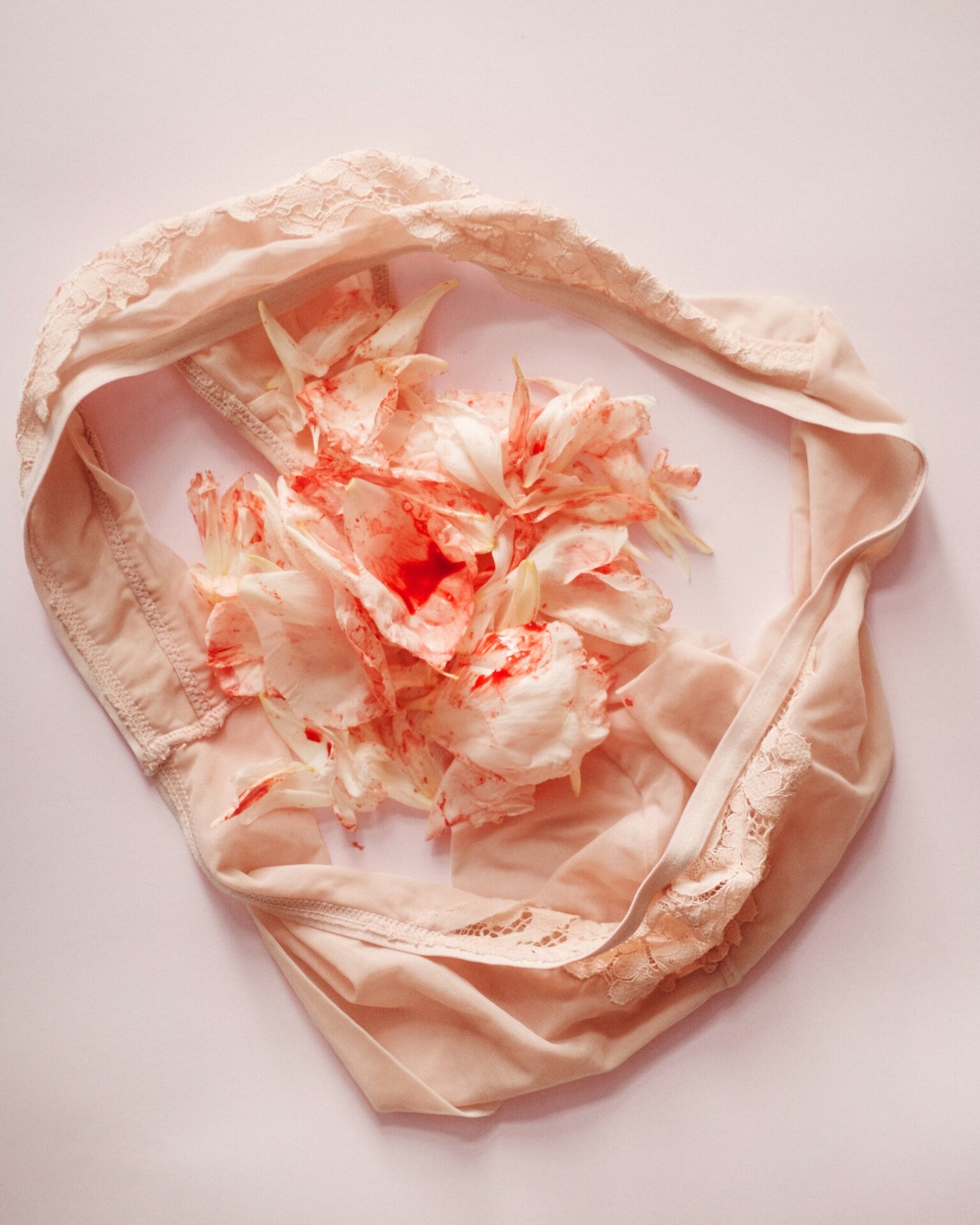 women's underwear stained with period blood clots