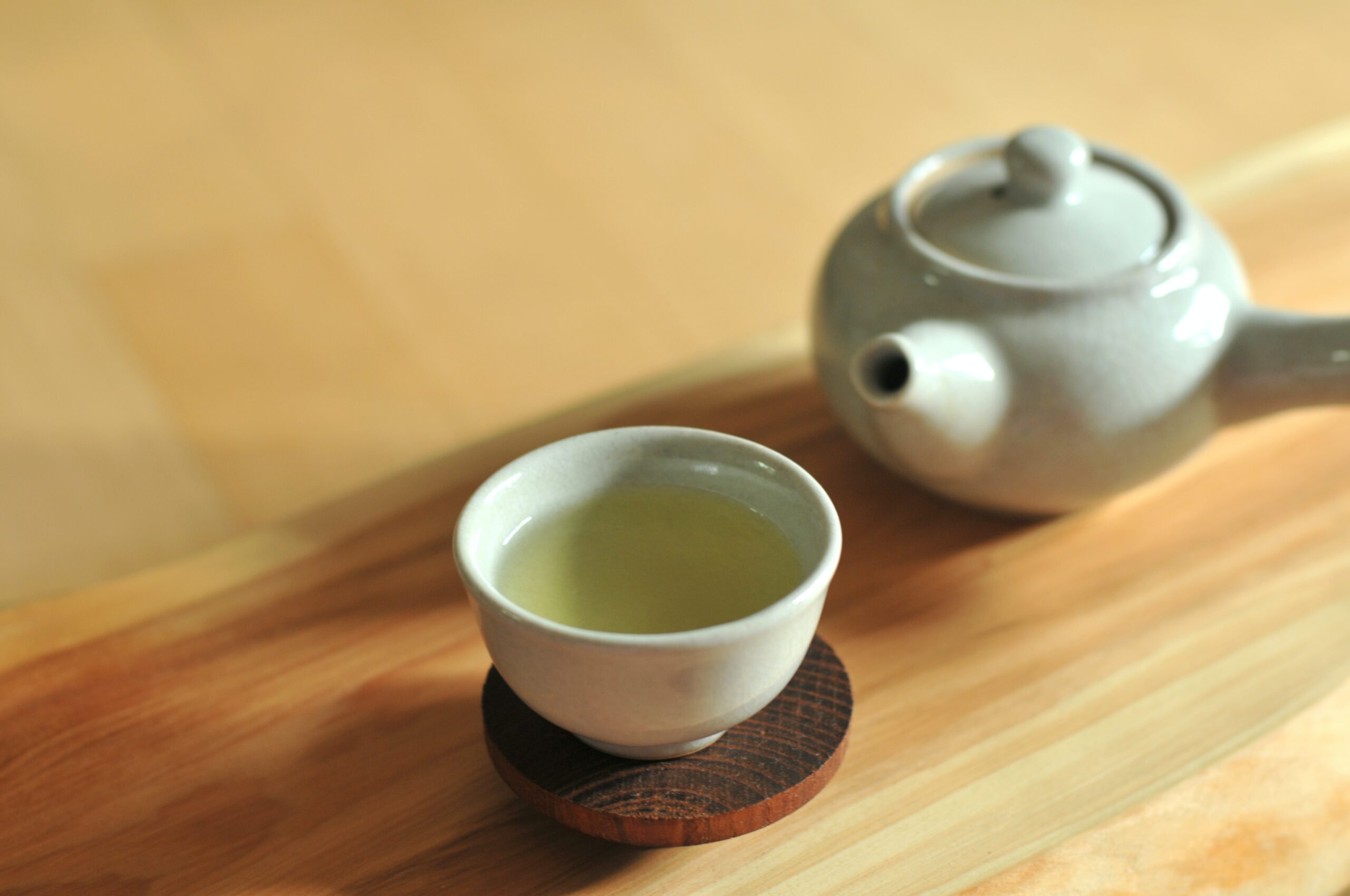 green tea cup on table