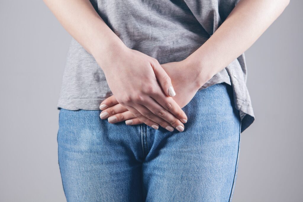 woman covering her pelvis