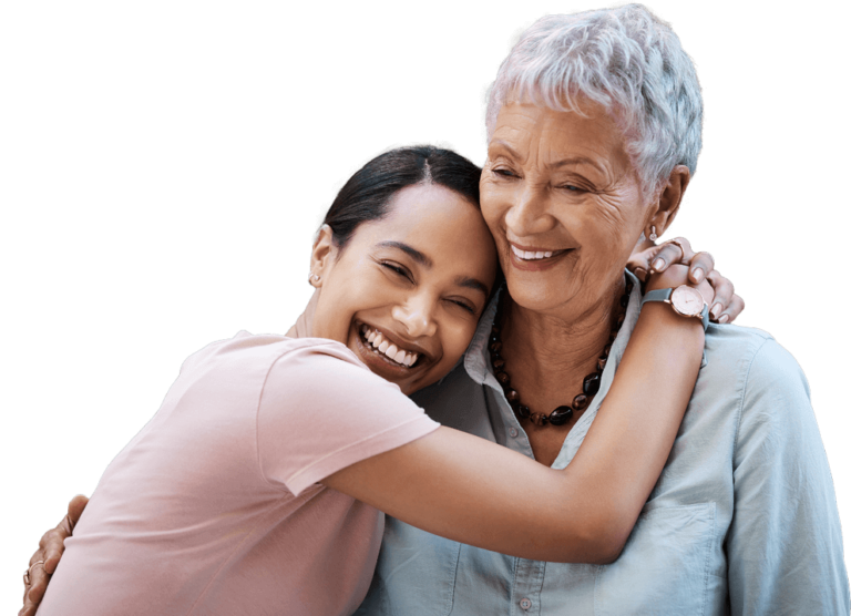 Young woman hugging older woman while smiling