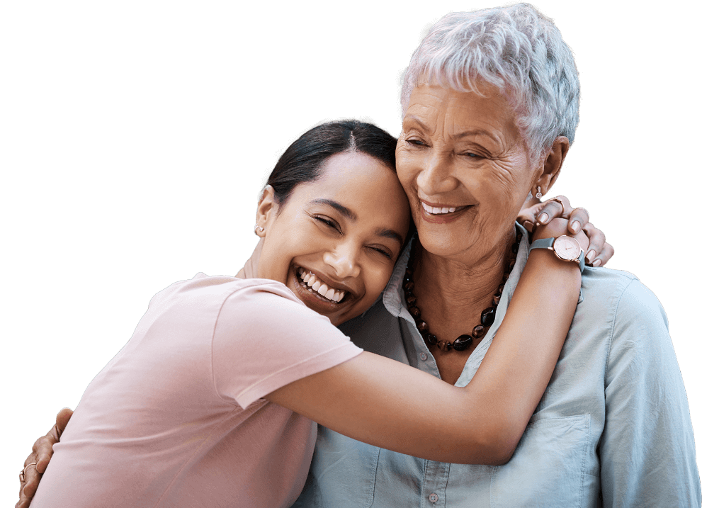 Young woman hugging older woman while smiling