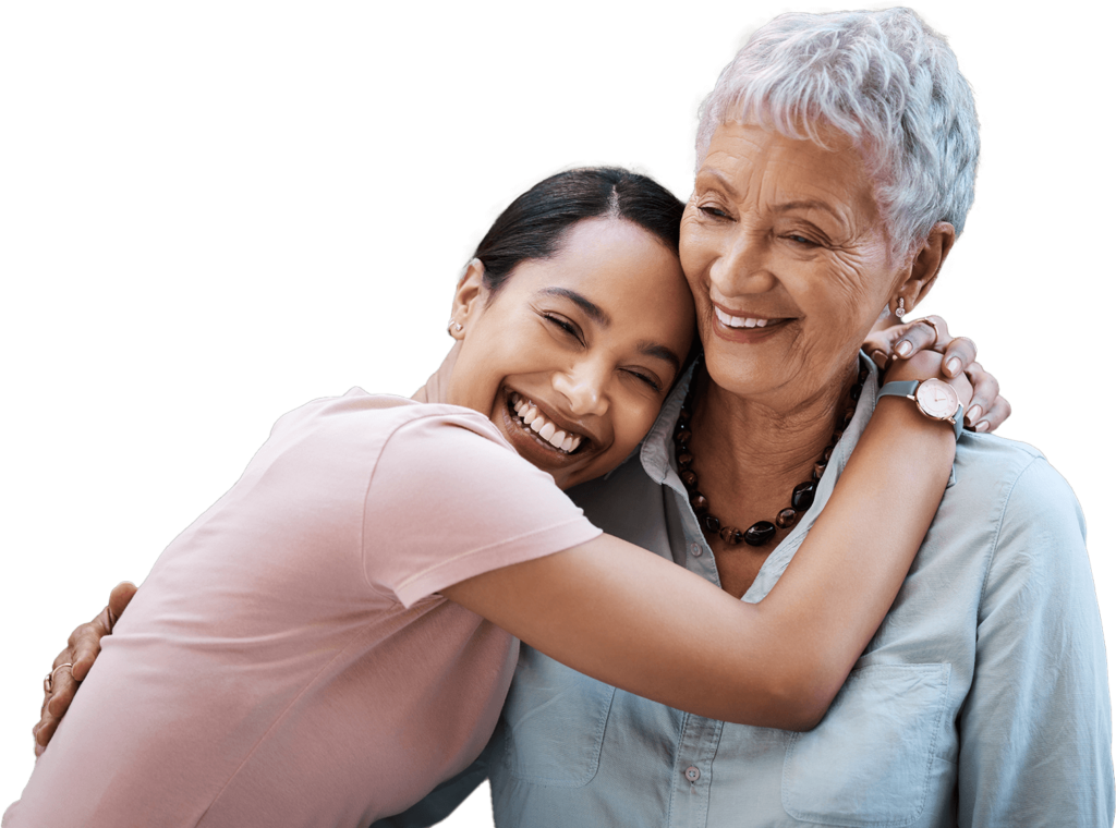 Young woman hugging older woman while smiling