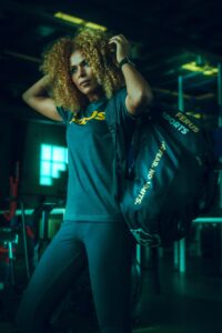 Woman with workout bag in gum