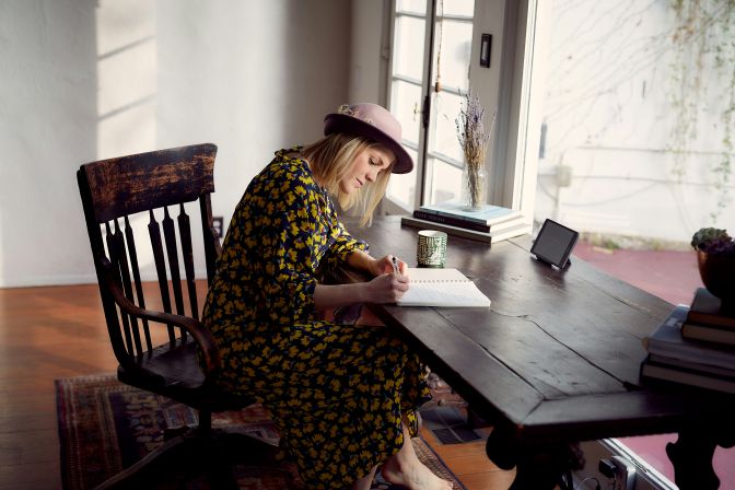 woman writing in journal